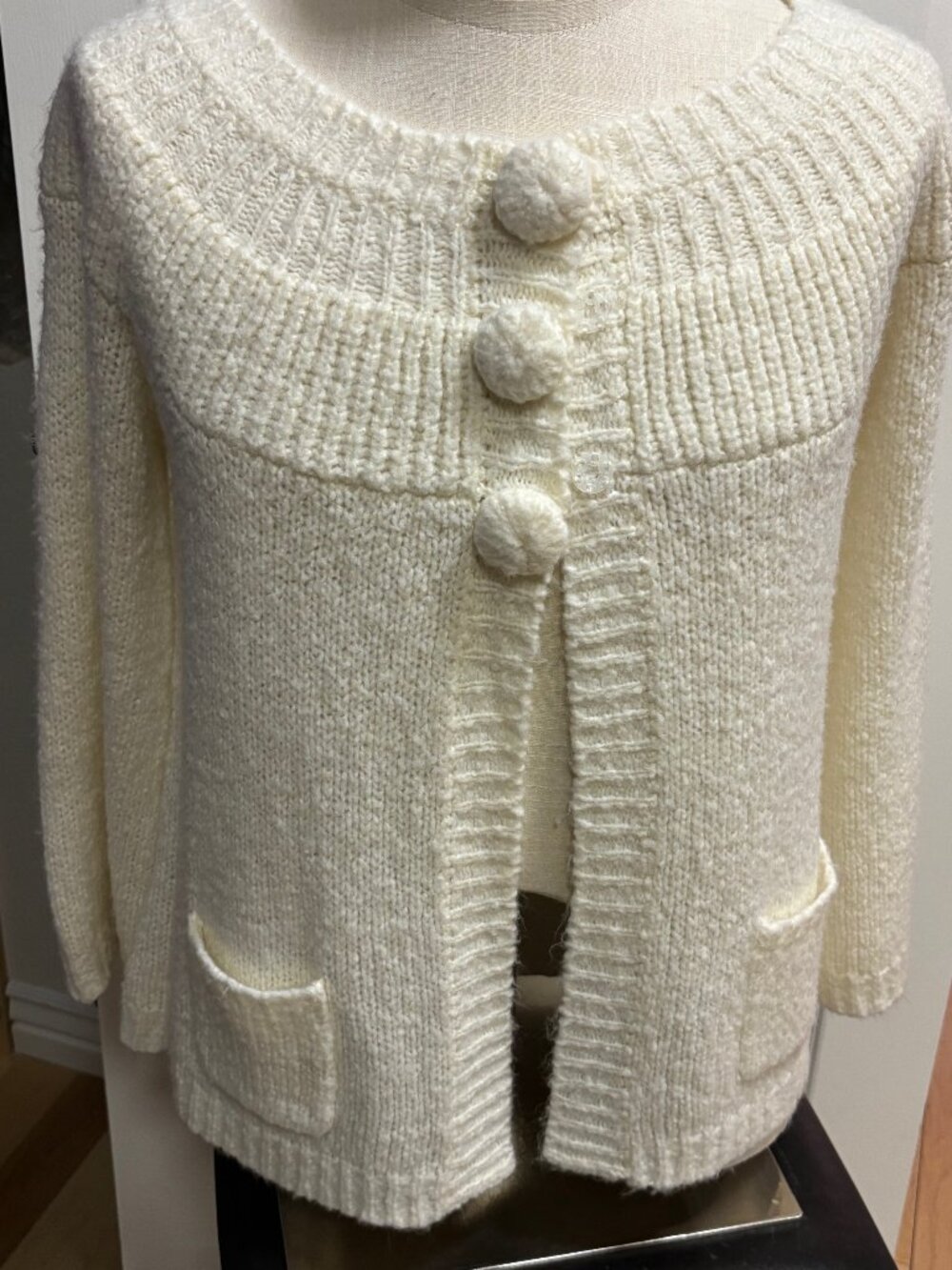 Cream textured sweater with oversized faux buttons